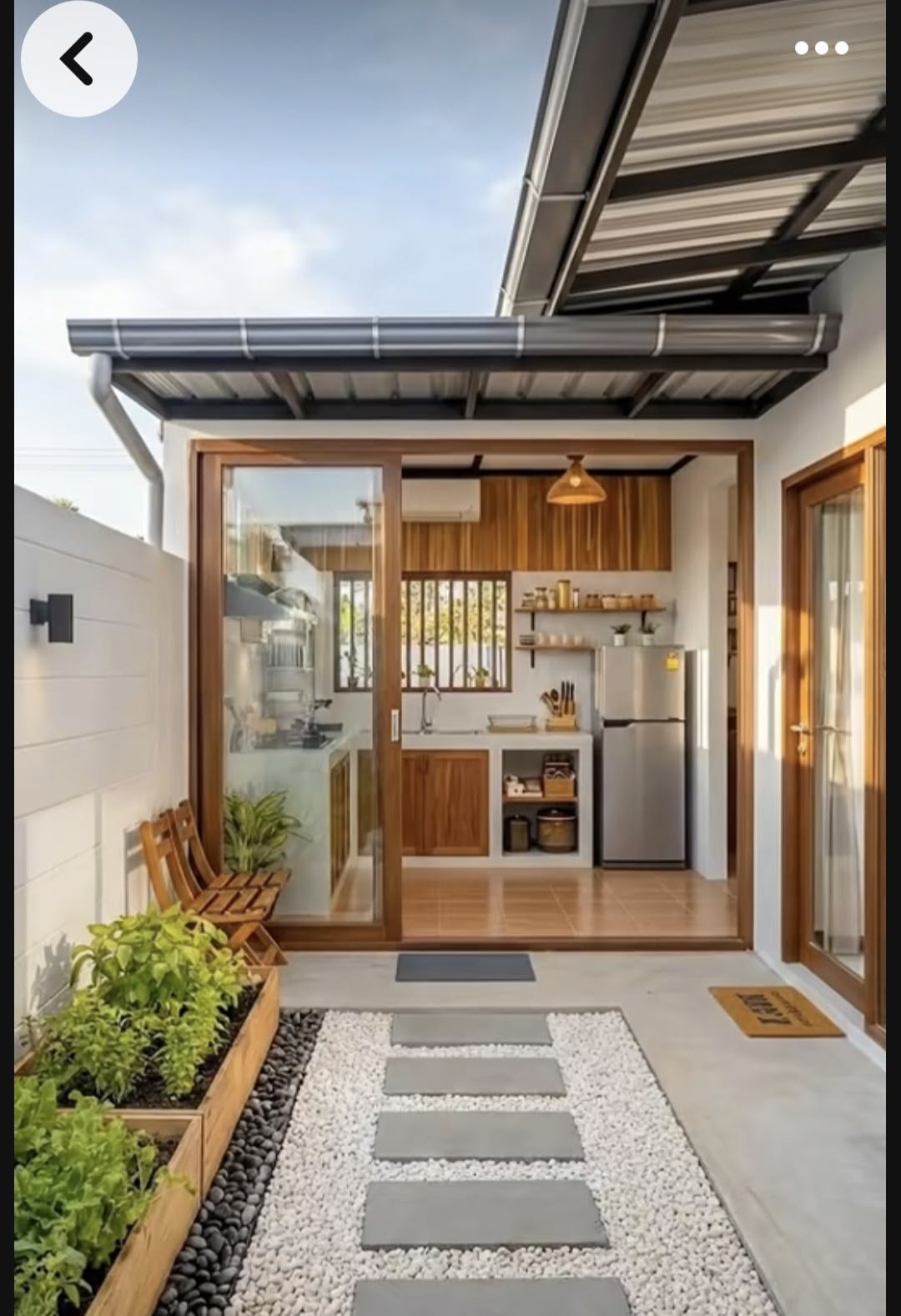 Exterior of the Birchwood accessory dwelling unit with a covered walkway and built-in kitchen